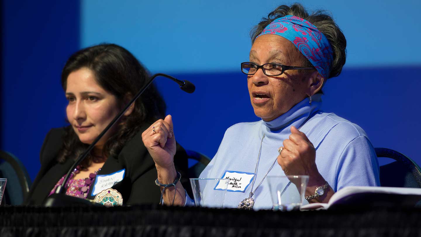 two women give a speech