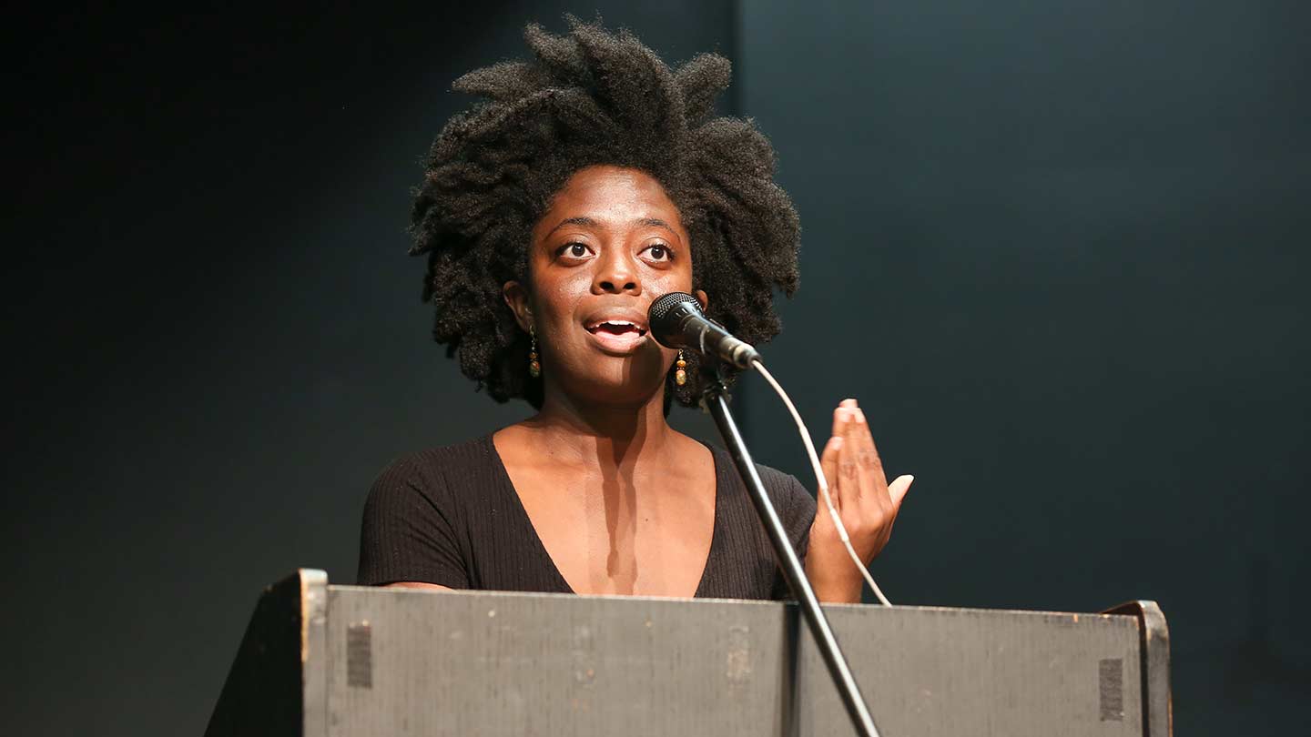 a woman gives a speech