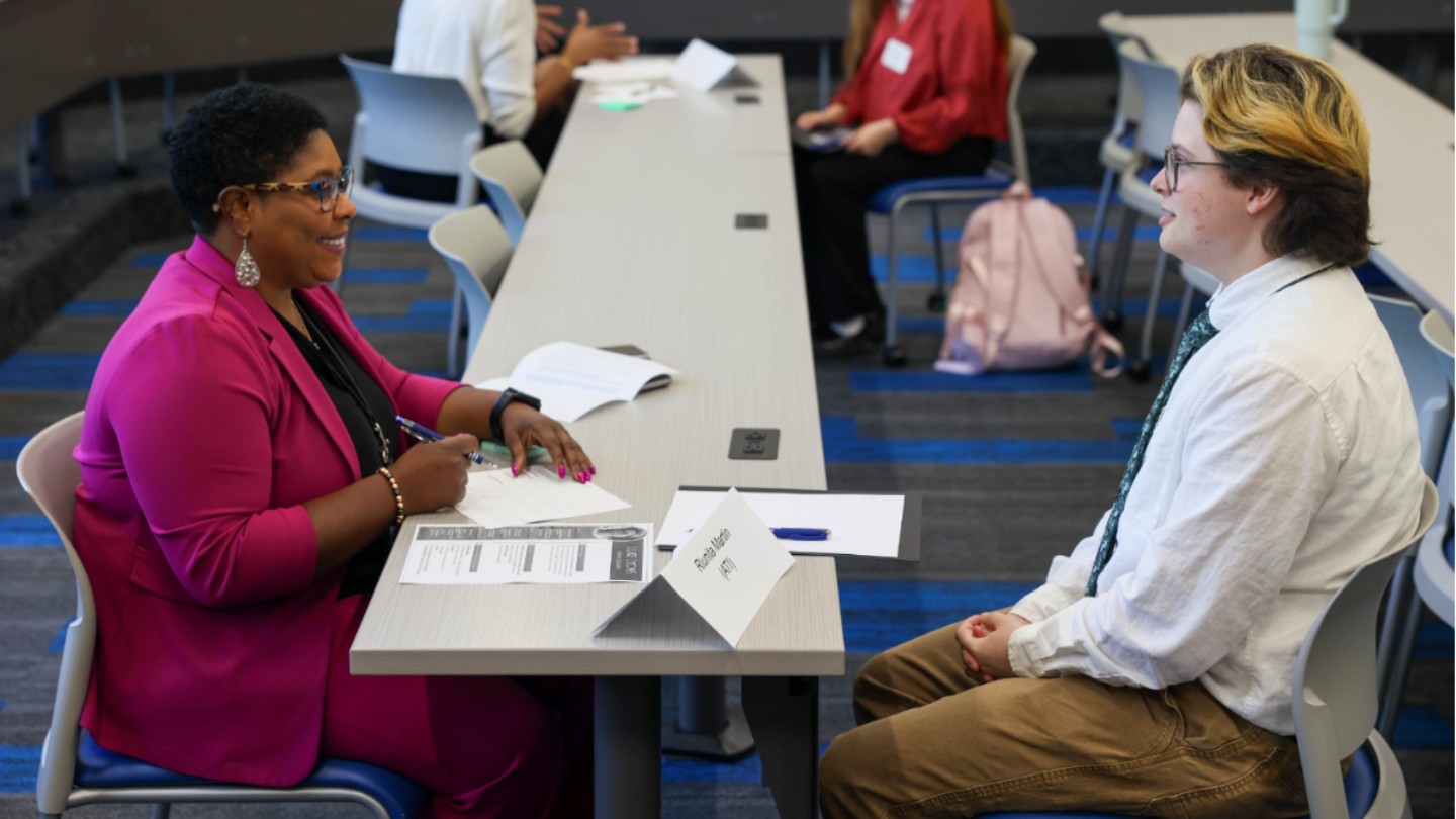 student interviewing with professional in morton hall classroom