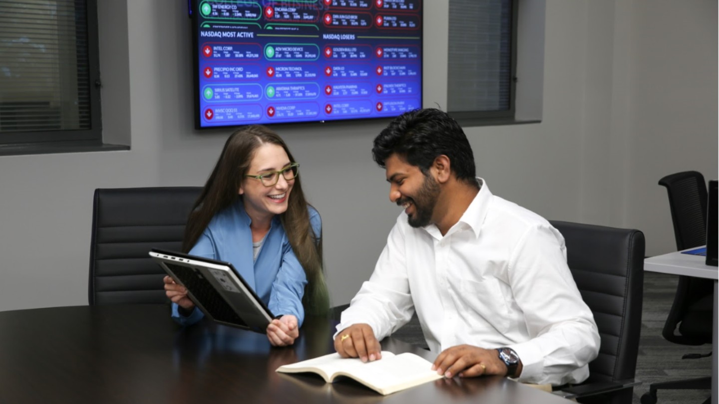 grad two students smiling for web