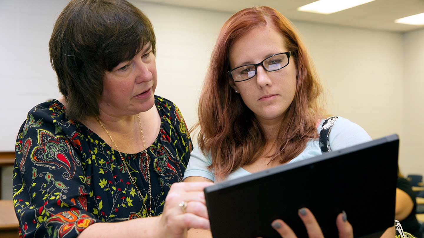 Beth Quick with a student
