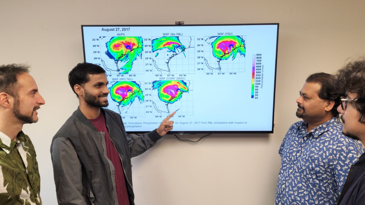 (L-R) Georgios Priftis, Ankur Kumar, Dr. Udaysankar Nair, and Dr. Sujit Roy discussing the precipitation patterns from the hurricane Harvey (2017)   ?>