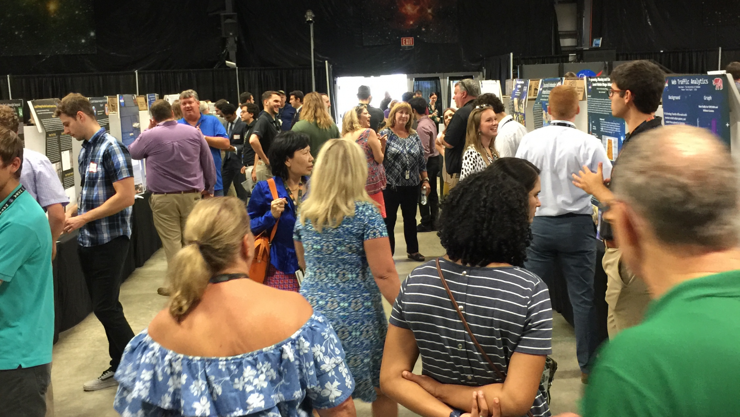 people stand about at a convention