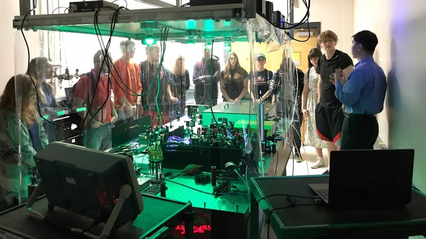 many people examine electrical equipment from a safe distance