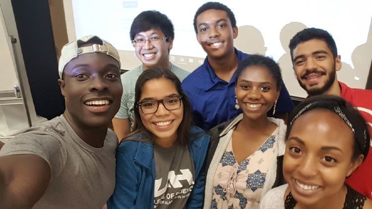 students pose happily