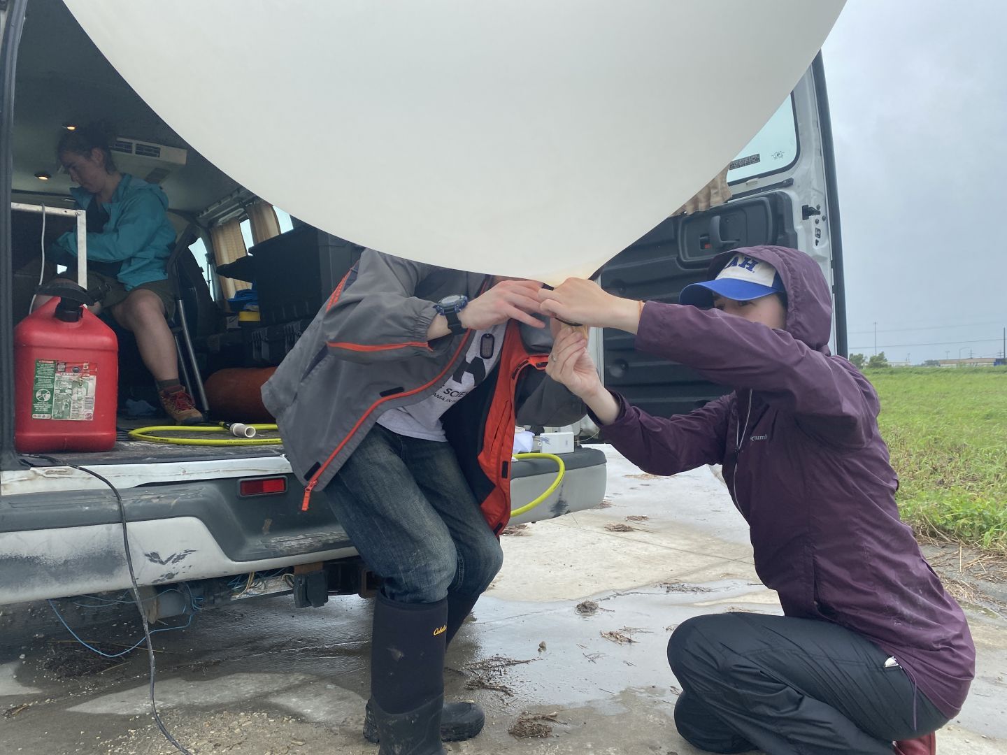 Students and researchers prepare weather balloon to launch ahead of Hurricane Ida.