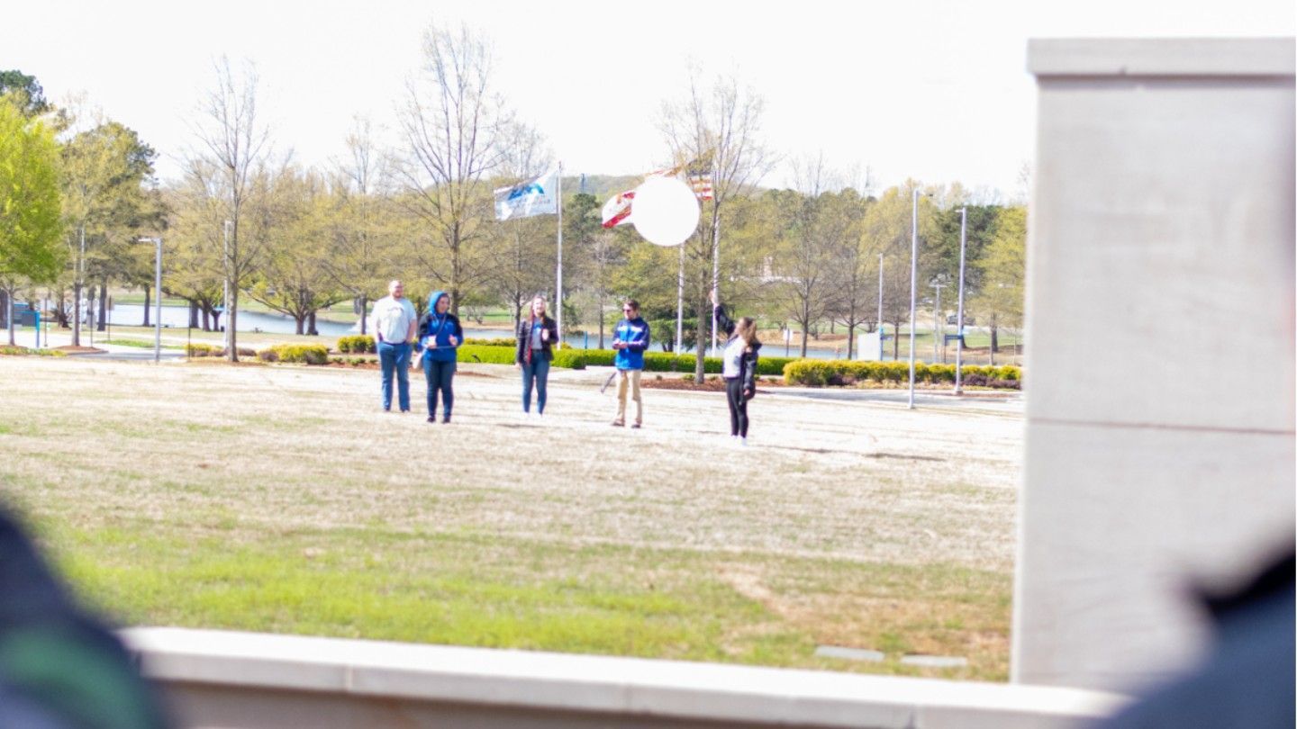 Atmospheric & Earth Science students launch weather balloon at Admitted Student Day.