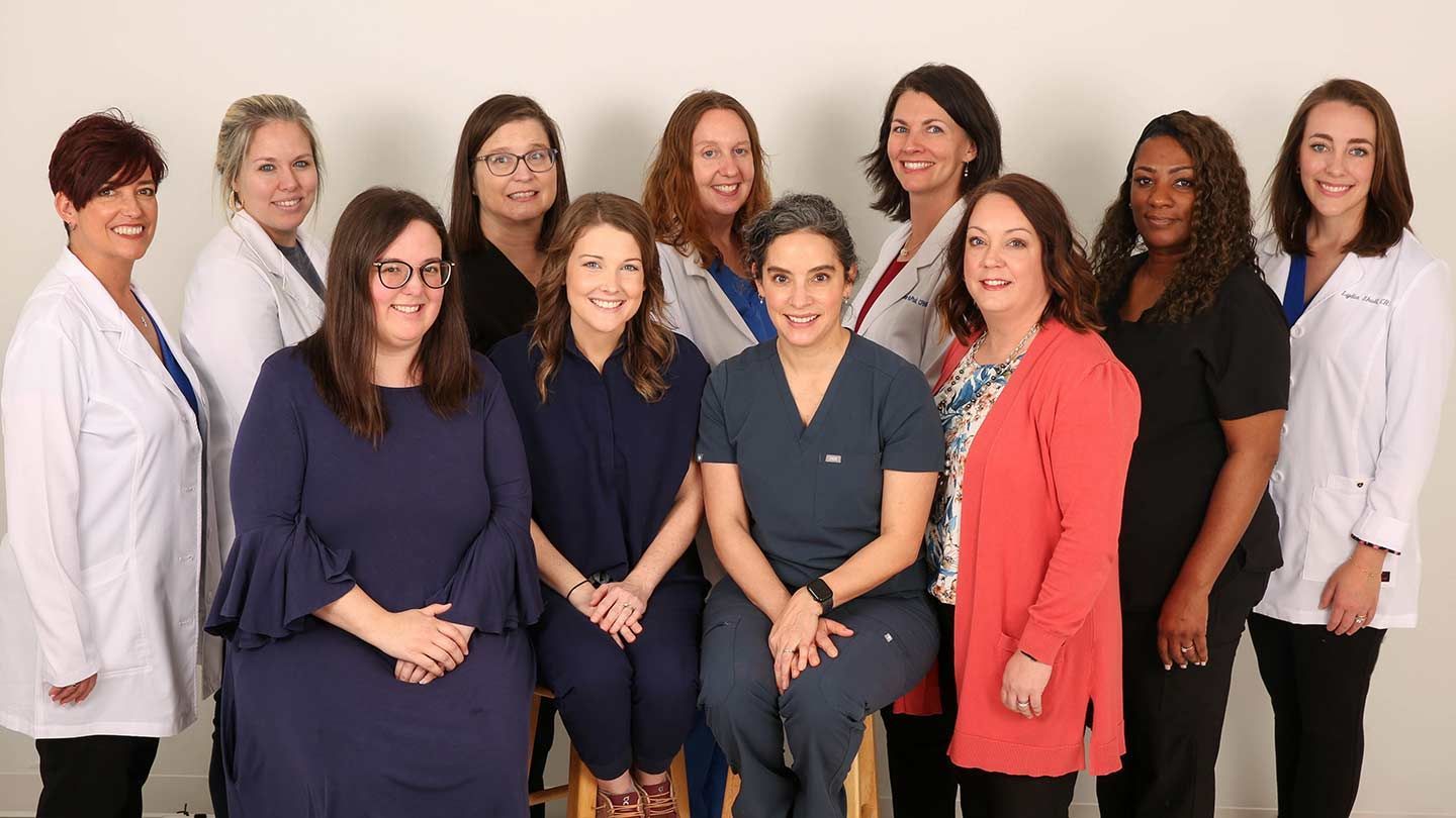 UAH clinic staff stand together