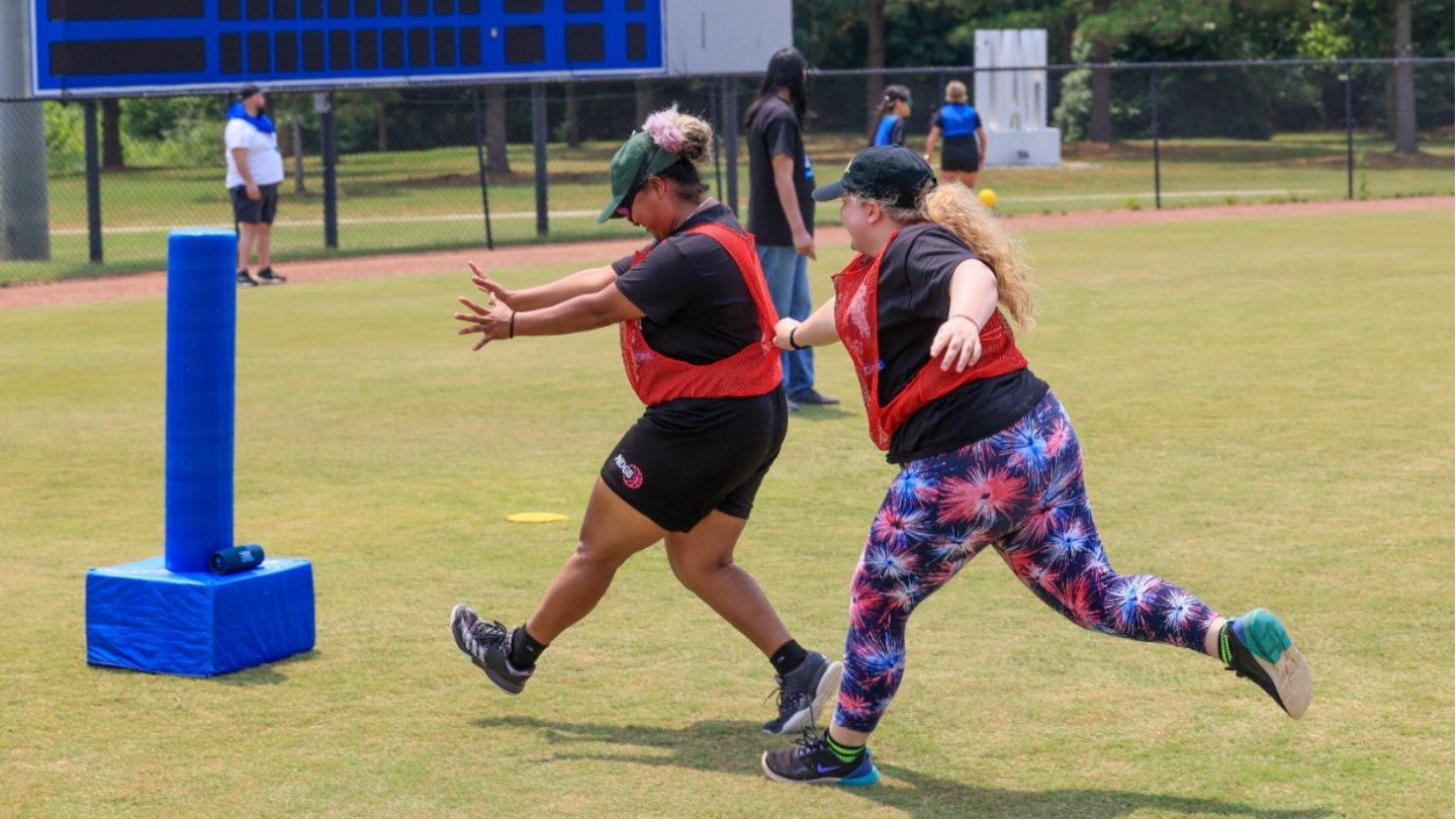 Individuals playing beep kickball