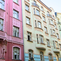 Pastel Art Nouveau facades line a Prague street