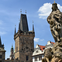 Baroque statue overlooking Malá Strana's rooftops and towers