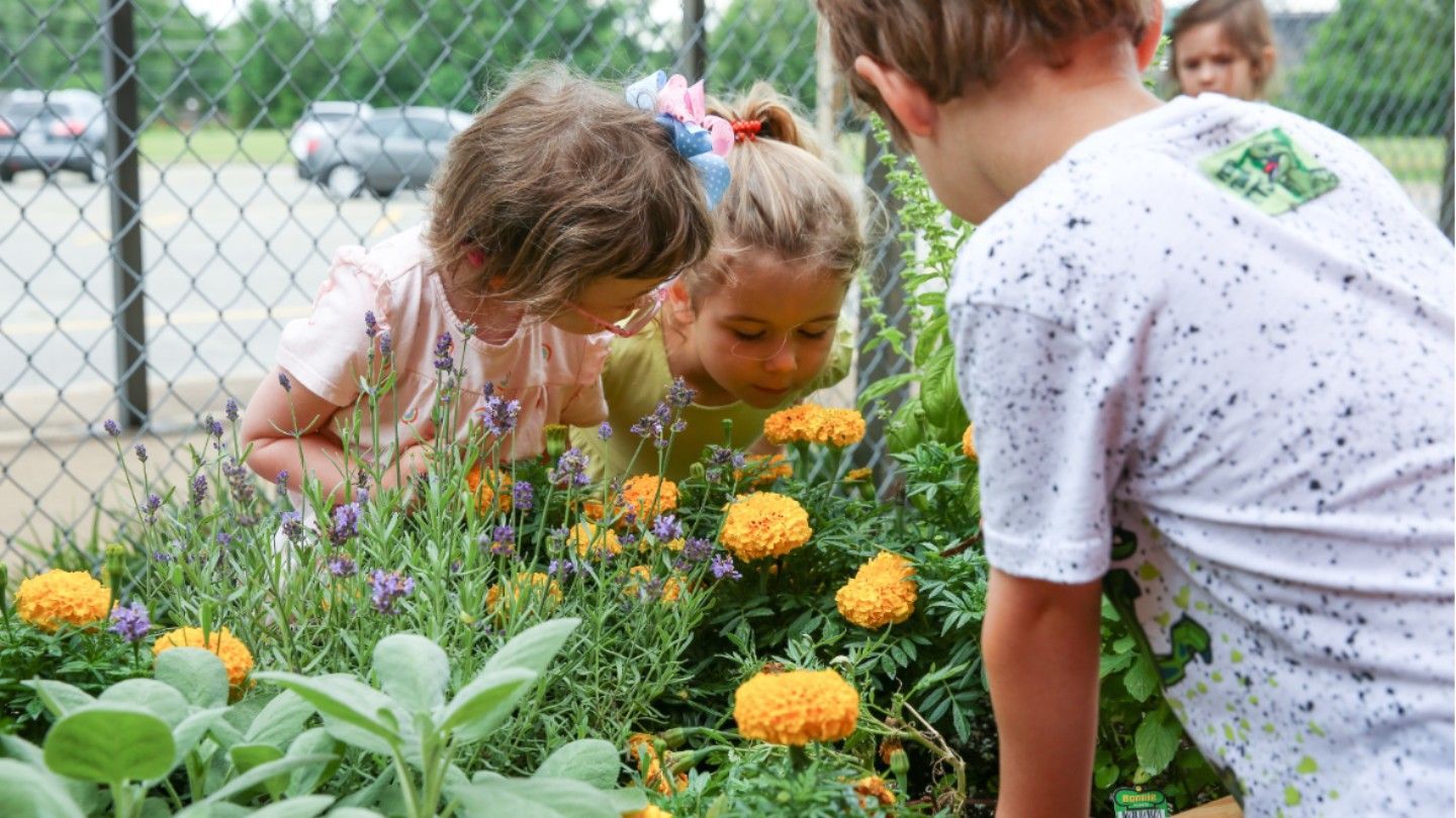 Children enjoy flowers