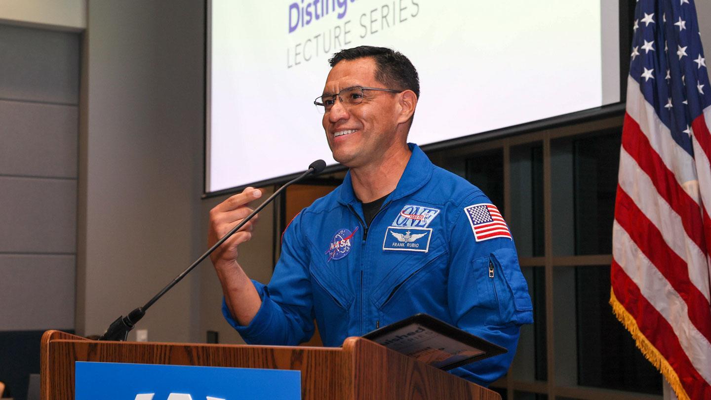 Colonel Frank Rubio speaks to an audience about his time as a NASA astronaut.
