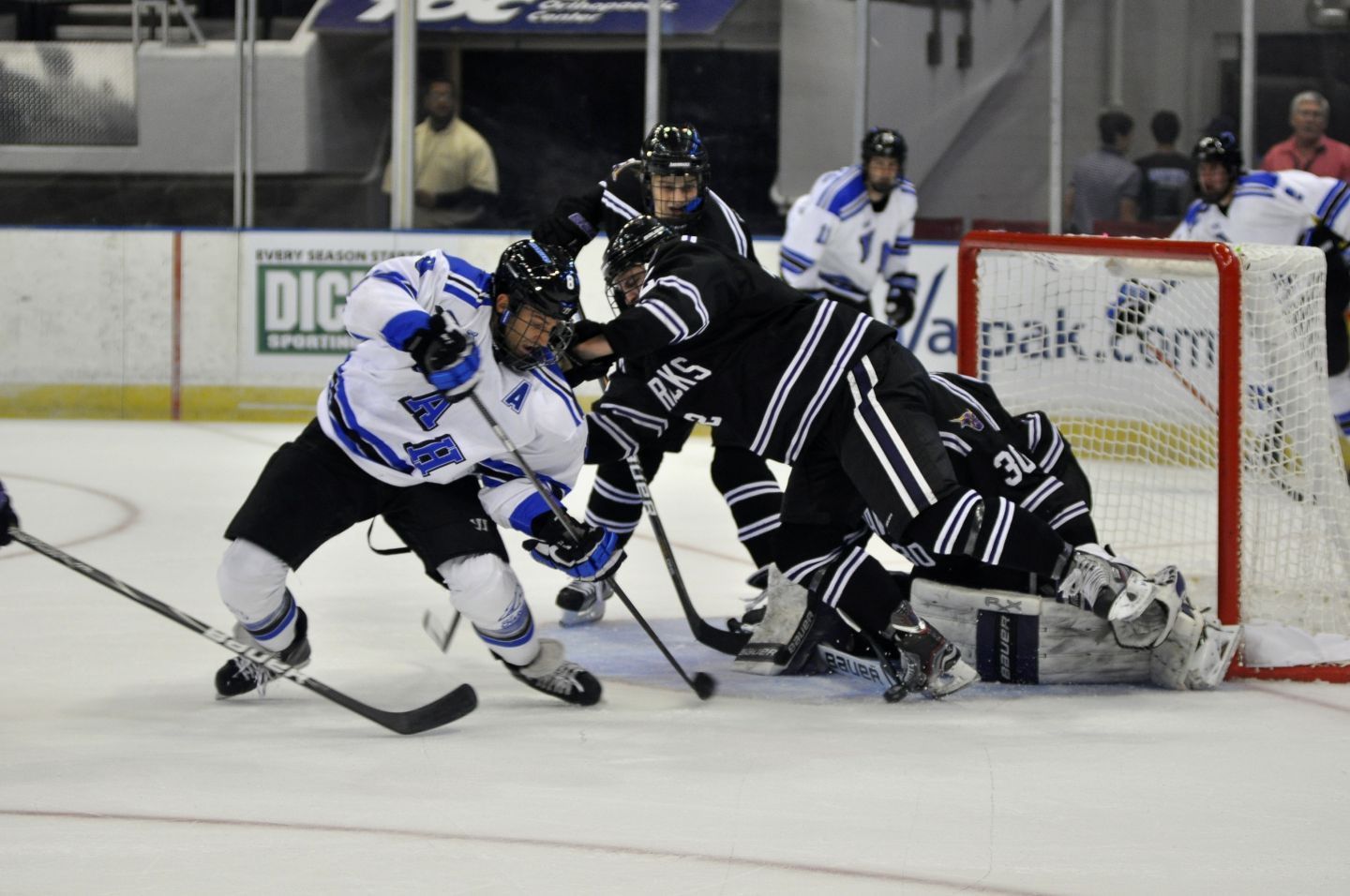 Hockey player collide on the ice
