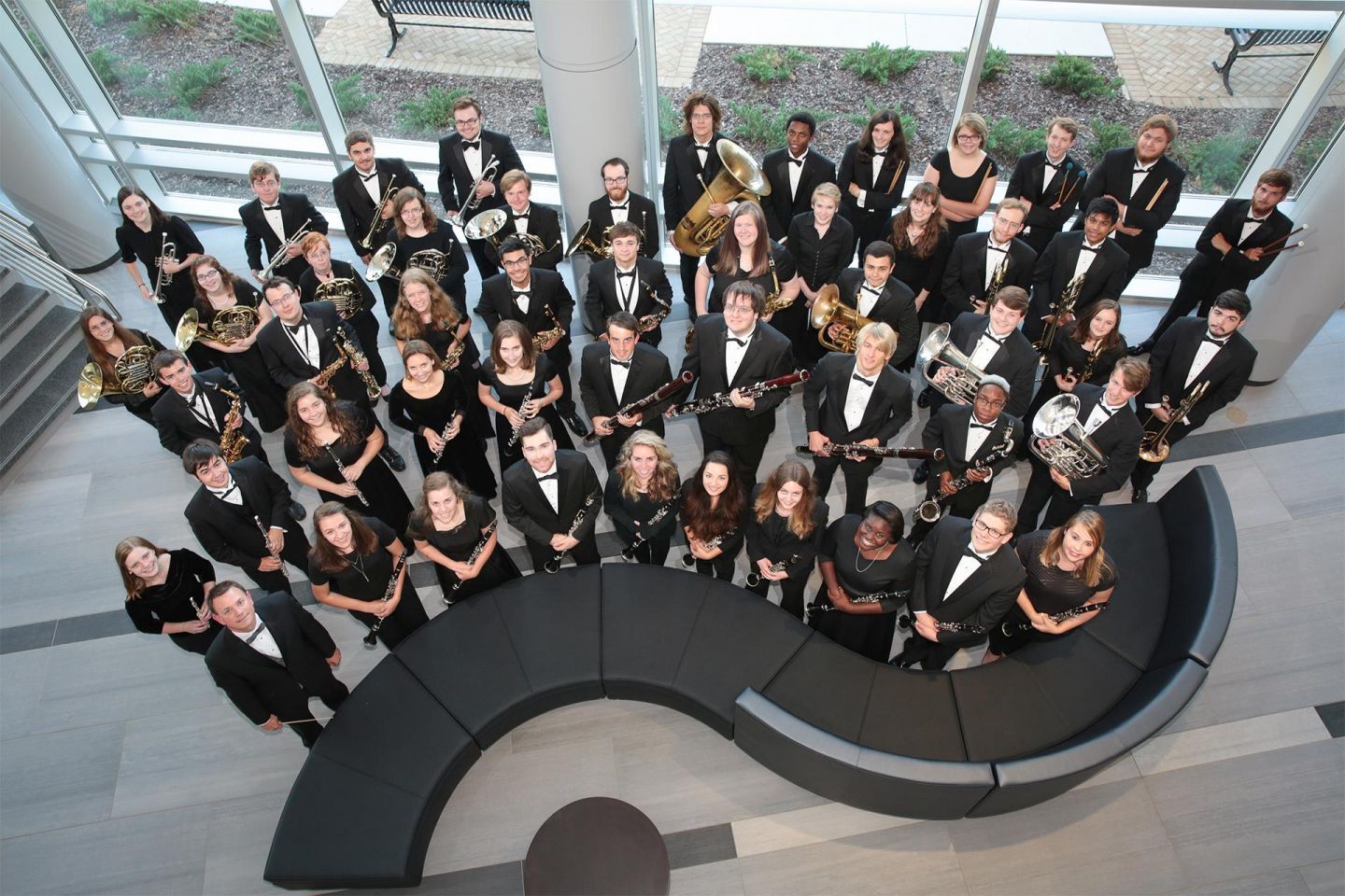 a formal orchestra poses