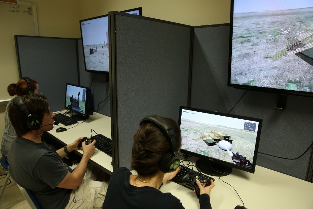 students play video games on computers
