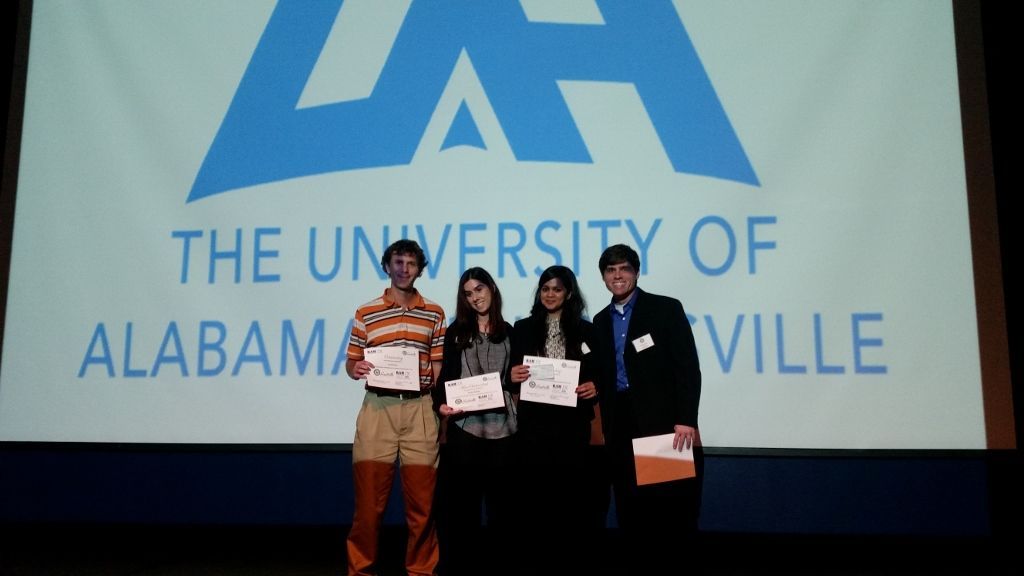 the winners of a poster contest receive their awards