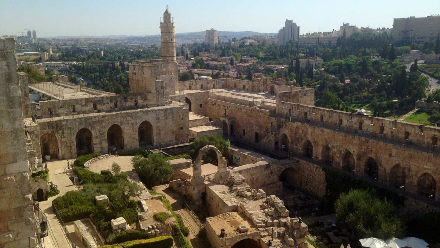 photo of old stone structures mixed within a current city