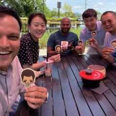 professor and students celebrating at a outdoor restaurant