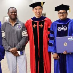 group photo of happy people at commencement