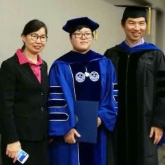 happy people in a group photo at commencement