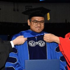 Nabil Hoque smiling during commencement