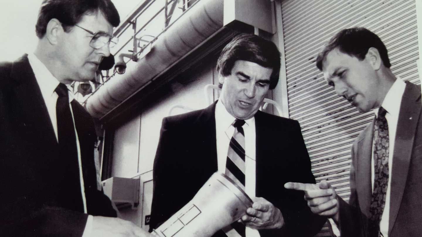 A black and white photo shows the founders of prc