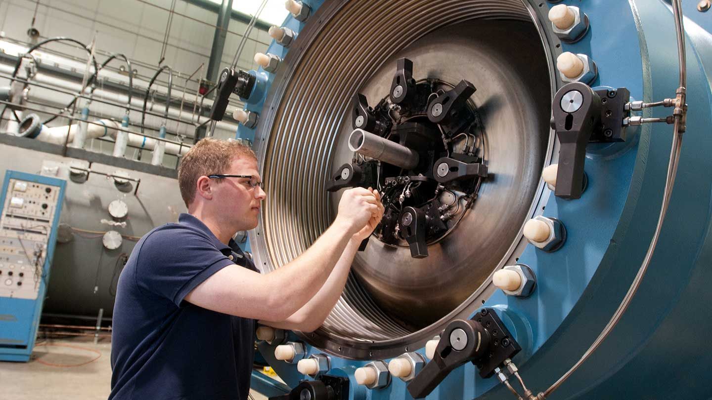 a man adjusts a large machine