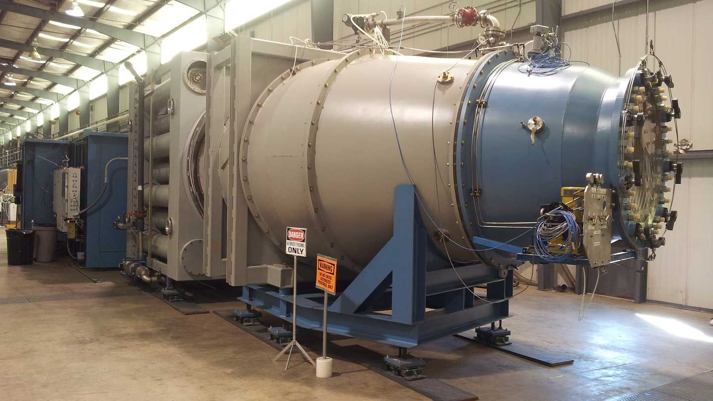 a large chamber is shown with two danger signs