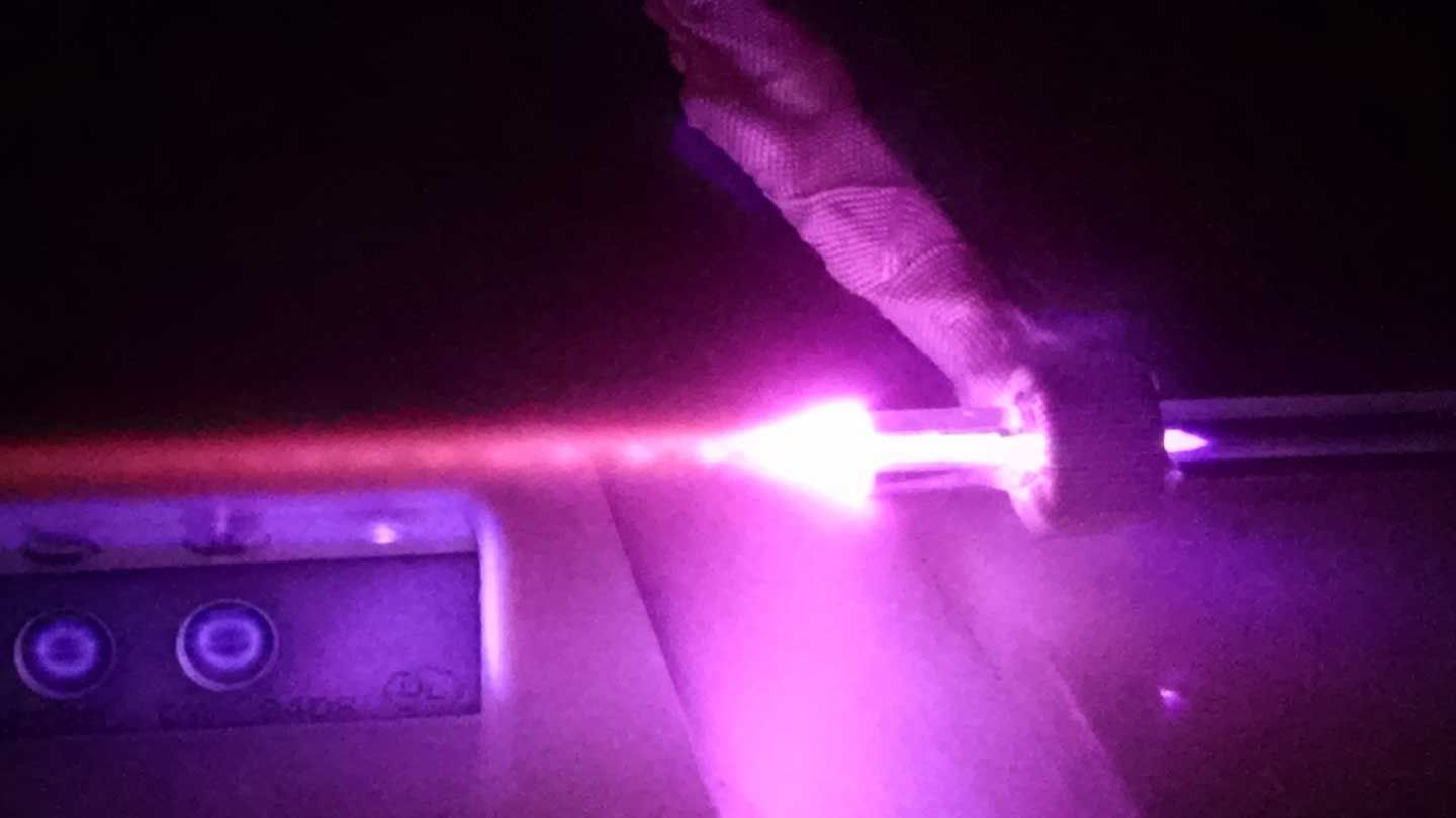 a purple laser is fired