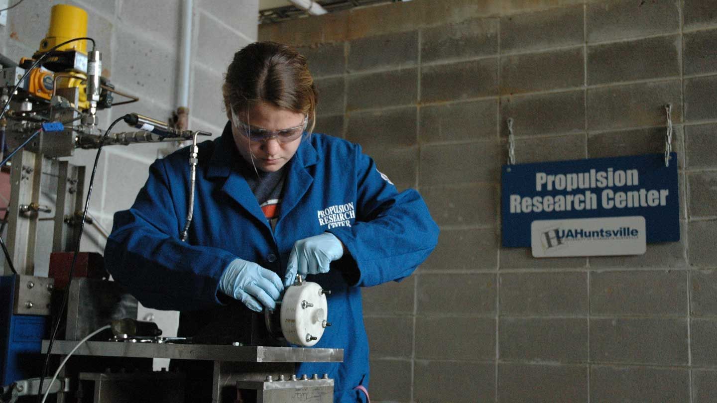 a student adjusts a device