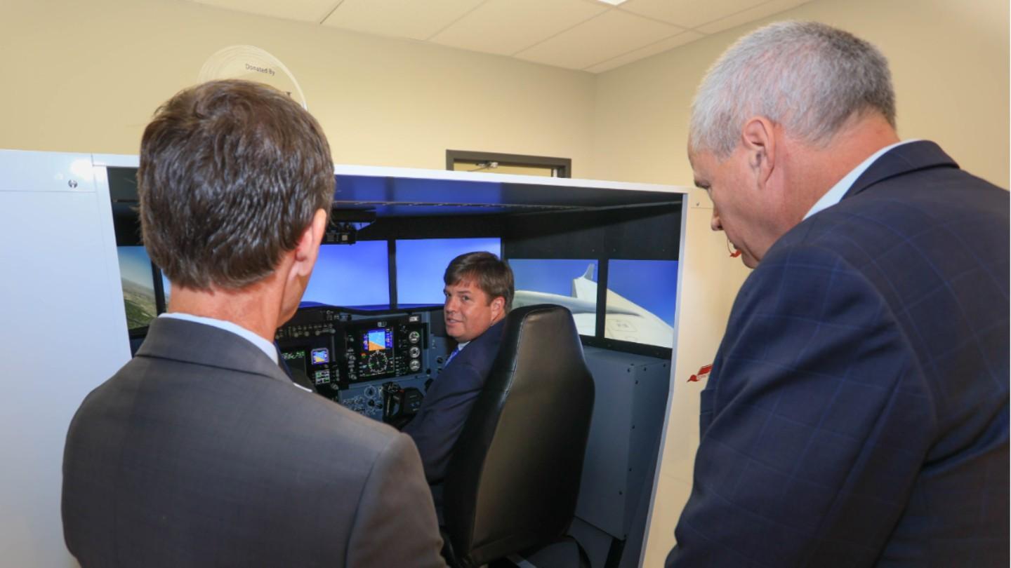 a man uses a flight simulator
