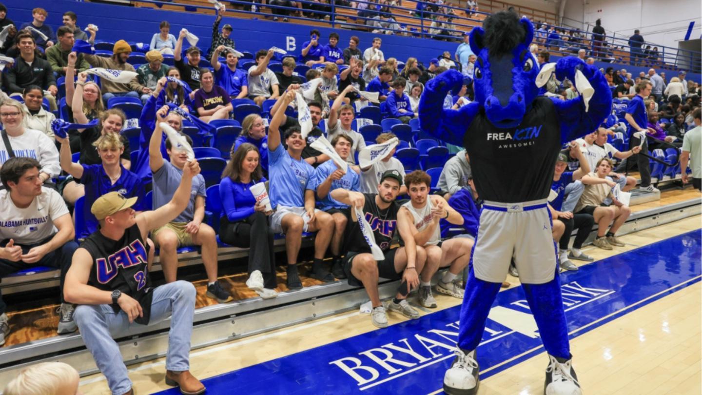 Charger Blue stands before a crowd