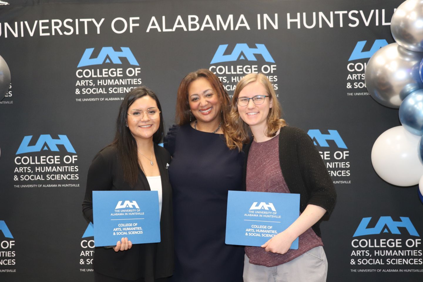 two women receive recognition