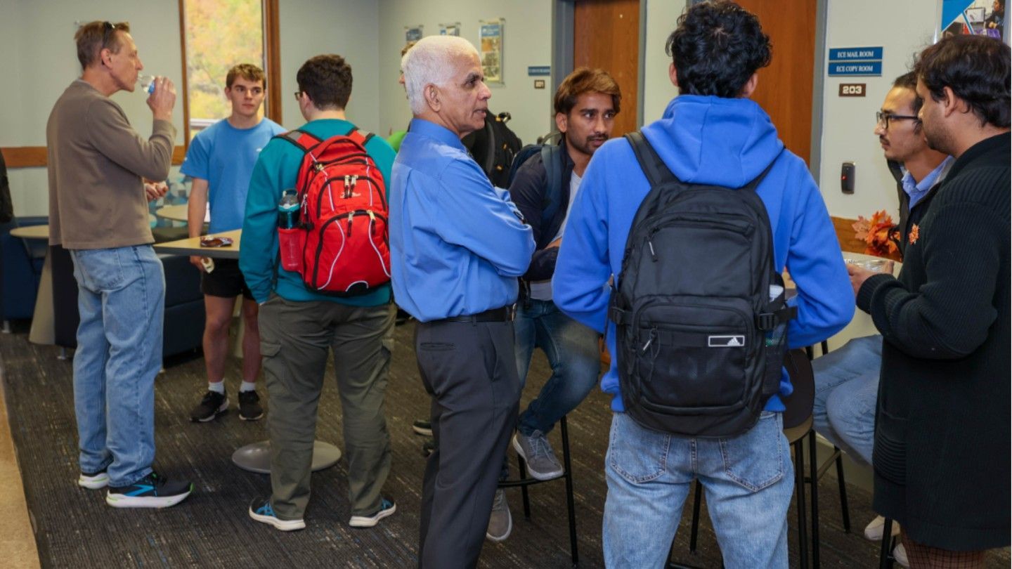 Students stand about with their instructors