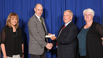 Last-Mile Scholarship Fund Check Presentation.  From Left to Right: Dean Karen Clanton; President Darren Dawson; OLLI at UAH Board President David Styers; OLLI at UAH Board Treasurer Janet Reville.