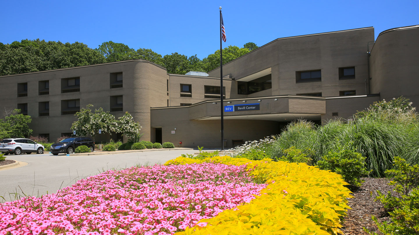 the front entrance and landscaping of bevill center residence hall at uah