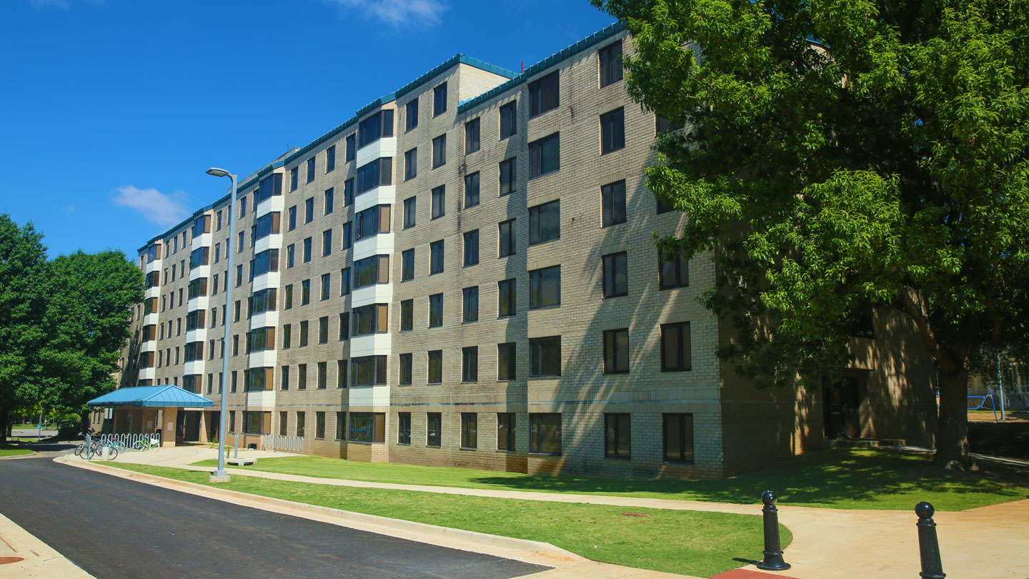 the front entrance of central campus residence hall at uah