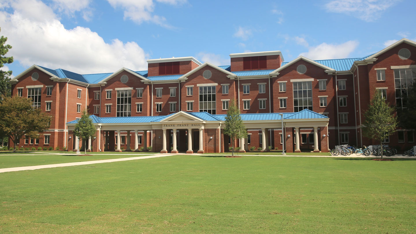 the front entrance and lawn of frank franz hall at uah