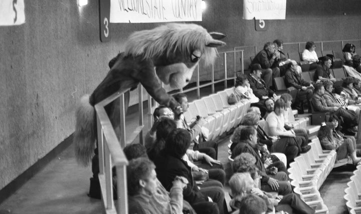 Newly christened “Charger Blue interacts with fans at the 1987 Homecoming hockey game against Ohio University.