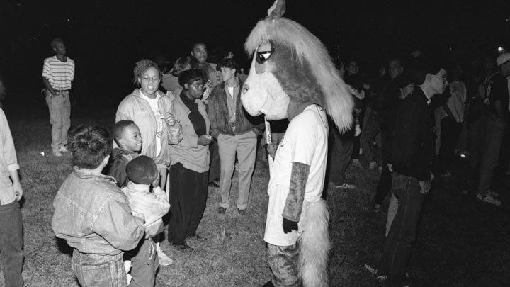 Charger Blue interacts with fans at the 1992 Homecoming bonfire.
