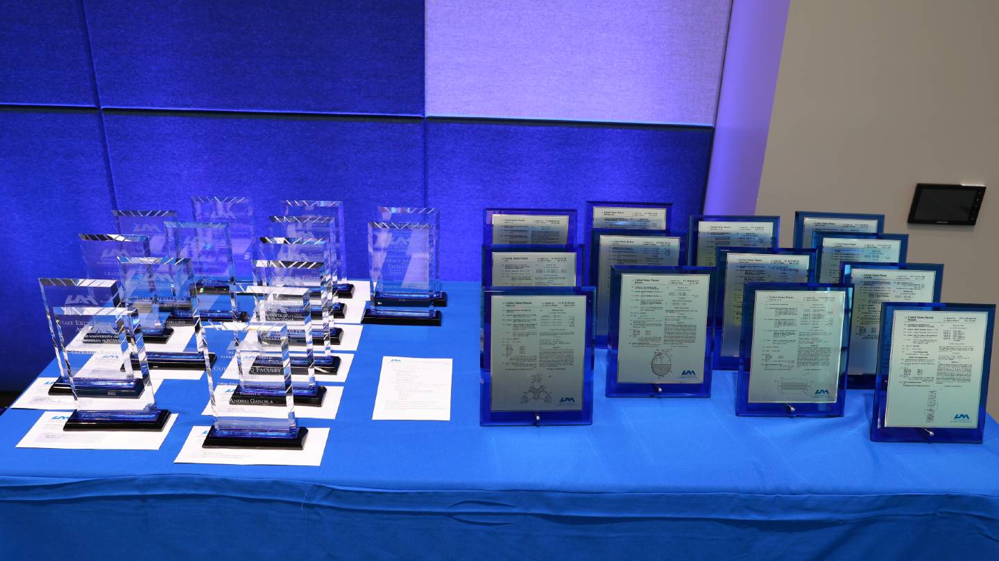 2022 university awards displayed on a table