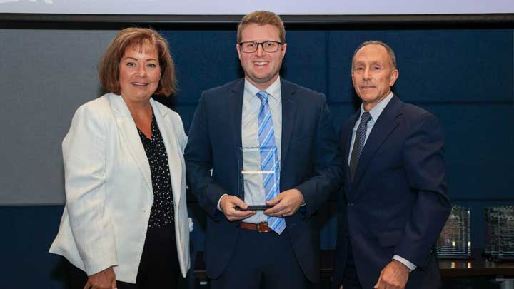 Dr. Jack Hontz, center, receives the Outstanding Faculty Award for the College of Arts, Humanities, & Social Sciences from Dr. Jodi Price, left, dean of the college, and Dr. David Puleo.