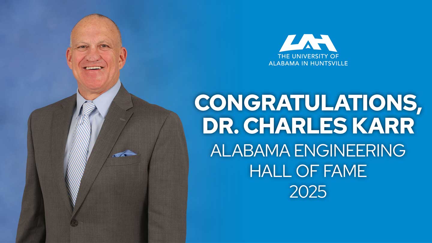 Dr. Charles Karr stands against a blue backdrop, with text congratulating him for the Alabama Engineering Hall of Fame 2025.