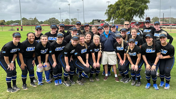 The University of Alabama in Huntsville (UAH) softball team and their coach, Les Stuedeman, pose with one of their loyal fans, UAH President Emeritus Dr. Robert Altenkirch, center.