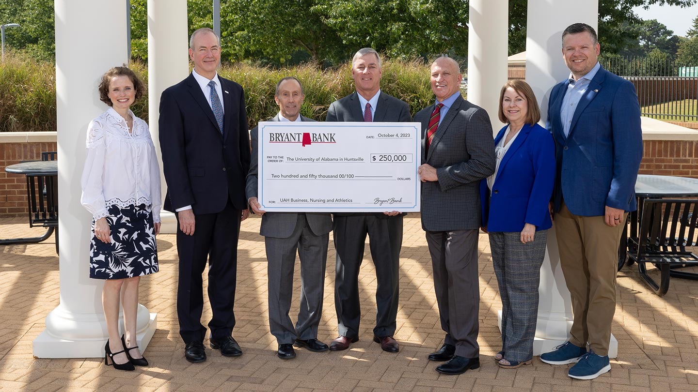 group photo presenting check