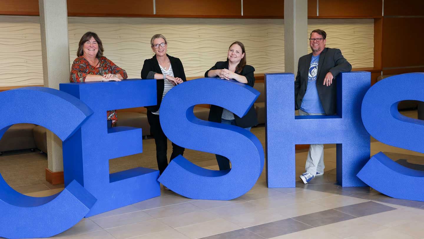 Faculty members in The University of Alabama in Huntsville College of Education, Sport, and Human Sciences – left to right, Dr. Beth Quick, dean; Dr. Jennifer Bruzek, assistant professor; Dr. Laura Senn, clinical assistant professor, and Dr. Jeremy Elliott, associate dean and associate professor.