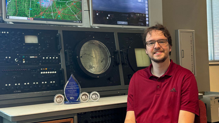 Christopher Kwinta, a master's student in the UAH Department of Atmospheric and Earth Science with his awards for being second top forecaster in North America.