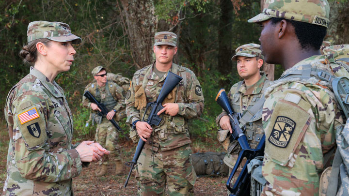 Col. Erin Eike, U.S. Army Garrison – Redstone Arsenal Commander, talks with ROTC cadets, including UAH students, facing, left to right, Joshua Bonson and William Tarpley, during field training exercises on Redstone Arsenal