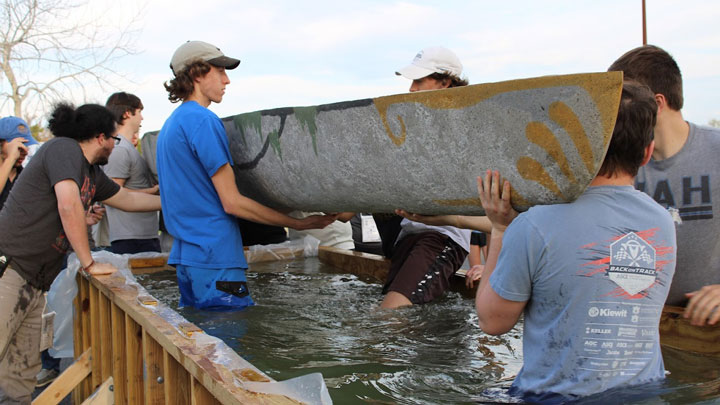 UAH engineering students racing a concrete canoe on the Bayou St. John in the 37th annual American Society of Civil Engineers